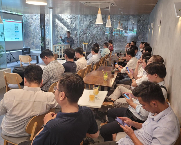 A group of people sitting in chairsDescription automatically generated